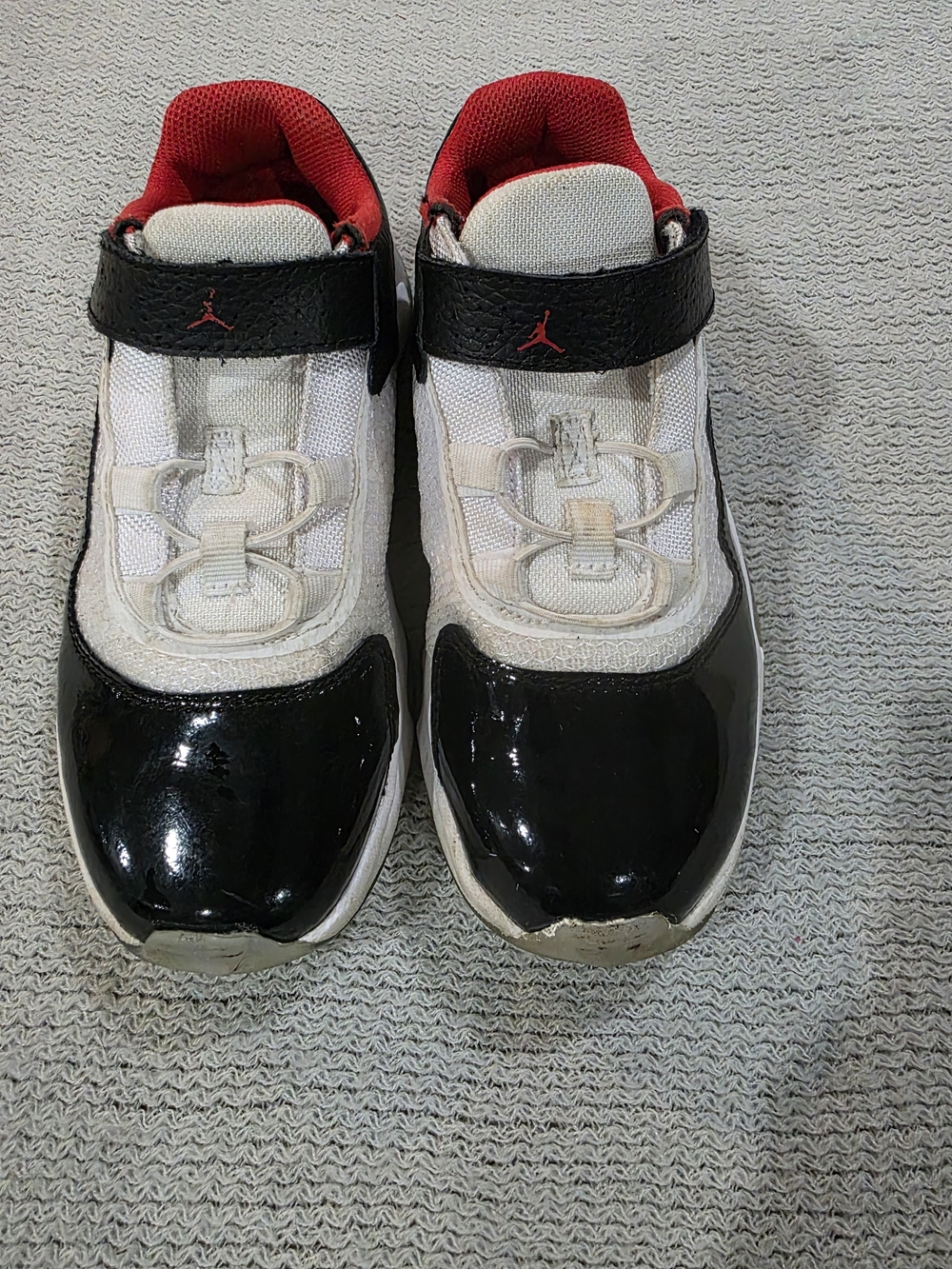 Jordan 11 CMFT Low Black and White Athletic Shoes with Red Accents - Jordan--3Y